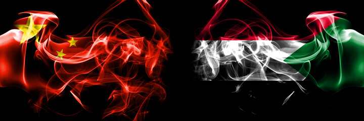 Flags of China, Chinese vs Sudan. Smoke flag placed side by side on black background.