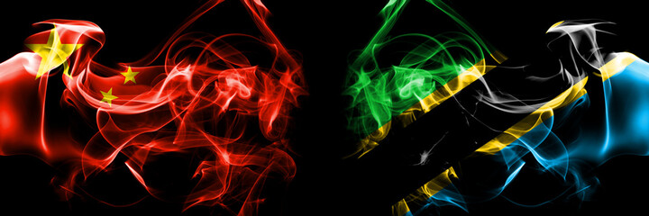 Flags of China, Chinese vs Tanzania. Smoke flag placed side by side on black background.