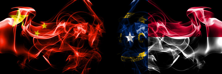 Flags of China, Chinese vs United States of America, America, US, USA, American, North Carolina. Smoke flag placed side by side on black background.