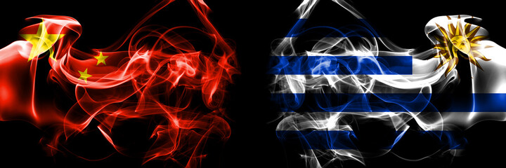 Fototapeta premium Flags of China, Chinese vs Uruguay, Uruguayan. Smoke flag placed side by side on black background.