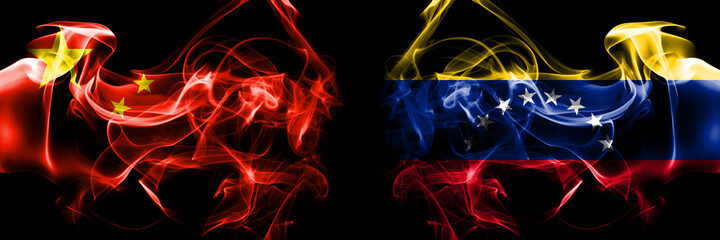Fototapeta premium Flags of China, Chinese vs Venezuela. Smoke flag placed side by side on black background.
