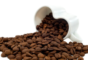 Coffee beans isolate. Coffee beans pouring out of a cup in the shape of a heart on a white background