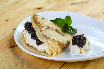 Pancake with cottage cheese and jam