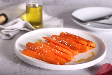 carrots baked in pieces are on the table