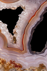 quartz crystals in light orange agate material slice