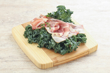 Raw pork bacon over board