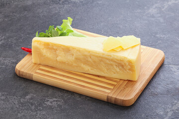 Parmesan cheese piece over board