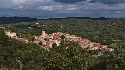 Fototapeta na wymiar Beautiful view of the historic center of small village Ramatuelle, France, located on a hill at the French Riviera, on cloudy day in autumn season.