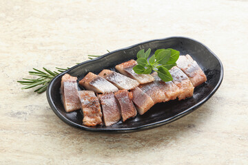 Delicous sliced herring fillet in grape sauce