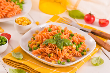 Fusilli pasta with peas and sweet corn.
