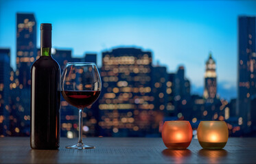 Red wine tasting and city skyline in the background