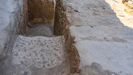 A staircase leads to the ancient Egyptian pyramid of Cheops. Rough stone steps close-up. Dense...