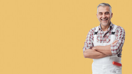 Painter and decorator smiling at camera © stokkete