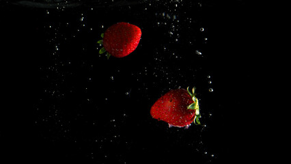 Colorful freshness fruit falling in to water splash and black background