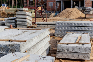 Reinforced concrete slabs and building materials at the construction site. Storage of materials for...