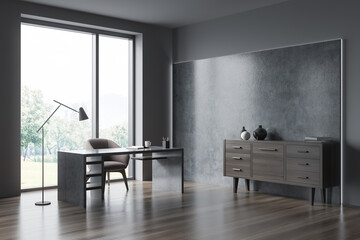 Grey personal office with illuminated concrete wall