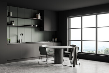 Grey and green kitchenroom with dining table. Corner view.