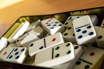 Domino game's pieces inside a metal box.