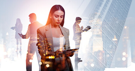 Businesswomen and businessmen wearing formal suits work together
