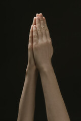 Fototapeta premium Praying hands to God in the dark. Woman hands reaching out to God or for help in barokko style