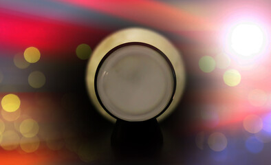 Crystal Ball on the table with bokeh, lights behind. Glass ball with colorful bokeh light, prediction concept.