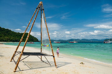 tourist on white sand beach at Hey island, Phuket