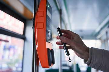 Senior man buy a ticket on public transport in the terminal using application