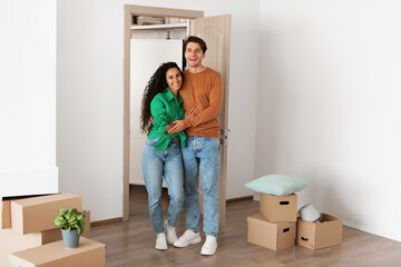 Fototapeta na wymiar Happy man and woman posing on moving day