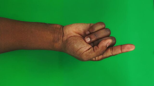 15 gestures Package for controlling touch screen with male Black hand on green screen. Beautiful men fingers with well-groomed manicure is ready for chroma keying. Set of arms for controlling touchpad