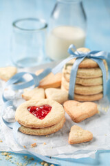 Obraz na płótnie Canvas Sweet valentine cookies made of jam and milk.