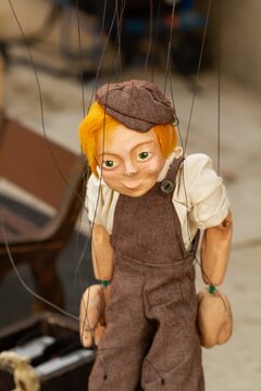 String cloth puppet on the street in Paris, selective focus.
