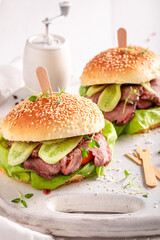 Homemade hamburger with lettuce, beef and pickles