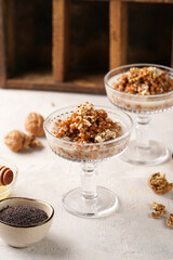 Traditional east european (ukrainian, polish, belarusian) religious christmas dish kutia made of wheat, poppy seeds, honey, walnuts and dried berries. modern style in champagne glasses