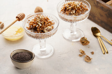 Traditional east european (ukrainian, polish, belarusian) religious christmas dish kutia made of wheat, poppy seeds, honey, walnuts and dried berries. modern style in champagne glasses