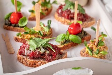 Delicious bruschetta with pesto and tomato for breakfast