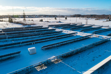 Aerial of solar panels covered with snow. Low efficiency during winter time in northern hemisphere. 