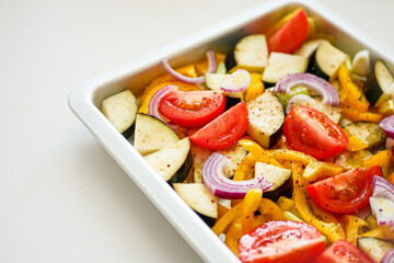 Oven Baking Vegetables, Peppers, Zucchini, Tomatoes on a Baking Tray, Sheet Pan Vegetables Background