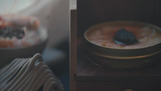 Shrimp Paste with Black Caviar in Wooden Box with Edible Flowers on top