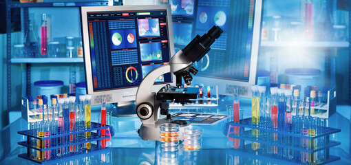 web banner of work table with microscope in a medical research lab or science laboratory