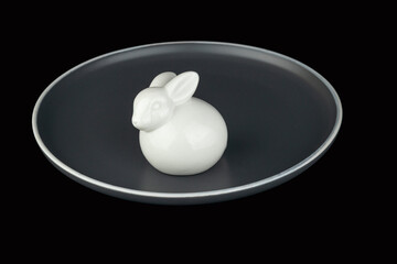 White easter bunny on a gray plate