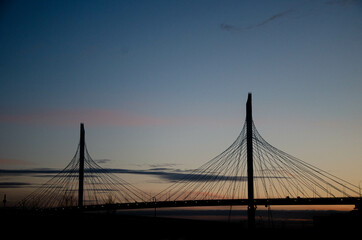 Fototapeta na wymiar suspension bridge at sunset