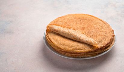 Pancakes for breakfast and carnival. A lot of pancakes are stacked.