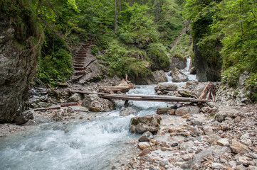 A valley between rocks with a river in the Slovenian Alps near the town of Kranjska Gora.