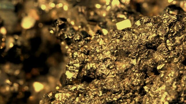 Close up view of hand piece made of pyrite crystals, fool's gold in crystalline aggregate, golden shining
