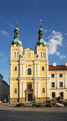 Fototapeta na wymiar Church of Assumption of Virgin Mary at Large square (Velke namesti) in Hradec Kralove. Czech Republic