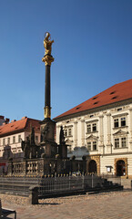 Fototapeta na wymiar Plaque column at square of Republic square in Plzen. Czech Republic