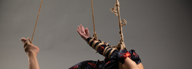 Hands tied behind