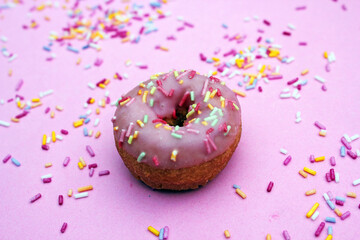 donut donuts sprinkles on pink frosting doughnuts pink bright sugar strands background