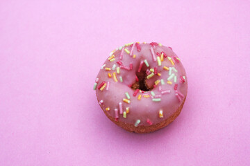 pink donut donuts sprinkles on frosted doughnuts pink bright sugar strands background