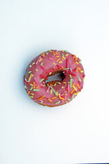 donut donuts sprinkles on doughnuts pink frosting bright sugar strands background
